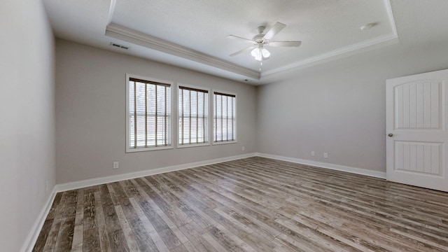1012 Michaela Cir, Clarksville, TN 37043 - empty room featuring a tray ceiling, ornamental molding, wood finished floors, and a ceiling fan