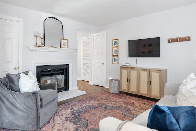 5813 Brentwood Trce, Brentwood, TN 37027 - living room featuring a fireplace with raised hearth and wood finished floors