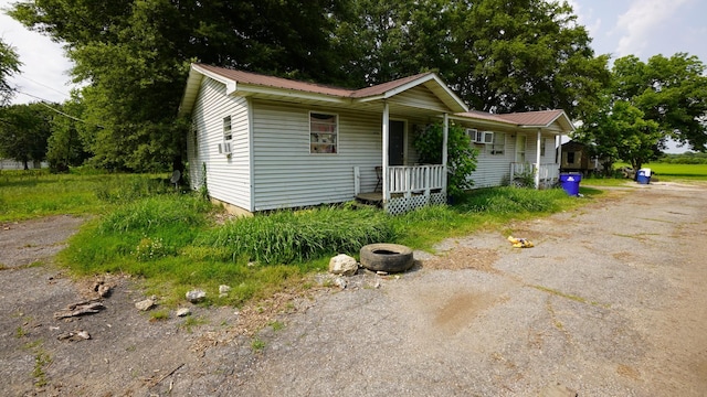 606 E Church St, Kenton, TN 38233 - bungalow with a porch and a metal roof