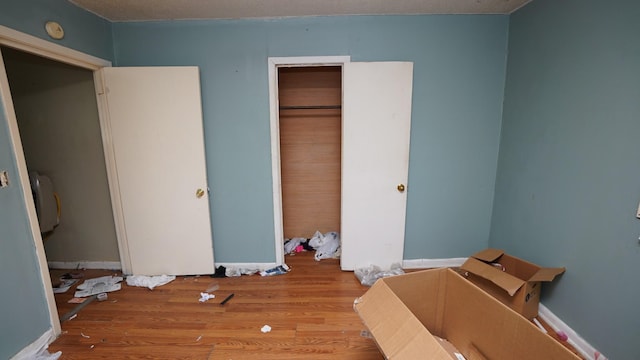 606 E Church St, Kenton, TN 38233 - unfurnished bedroom featuring wood finished floors