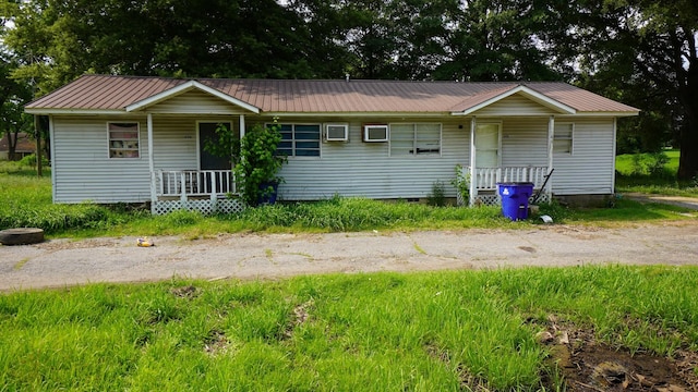 606 E Church St, Kenton, TN 38233 - single story home with a porch, a metal roof, and crawl space