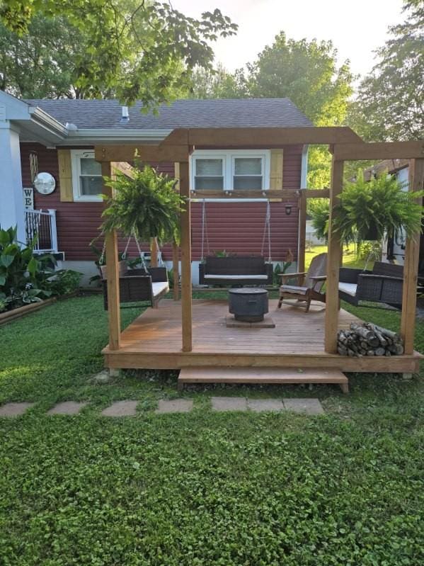 117 June Dr, Dickson, TN 37055 - back of property with a deck, a fire pit, and a lawn