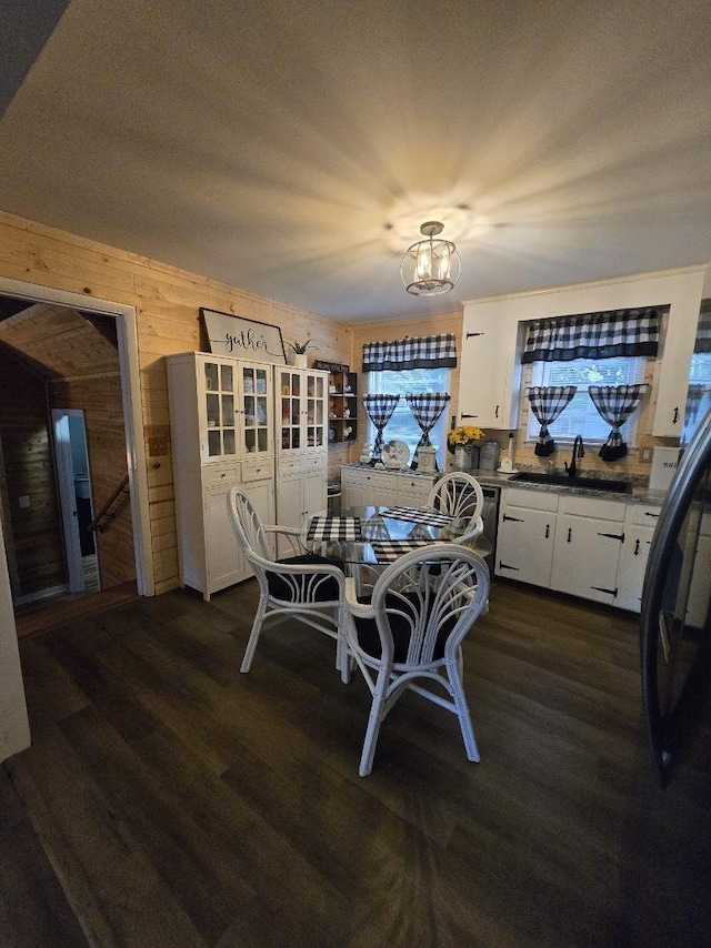 117 June Dr, Dickson, TN 37055 - dining space with wooden walls, dark wood finished floors, and a chandelier