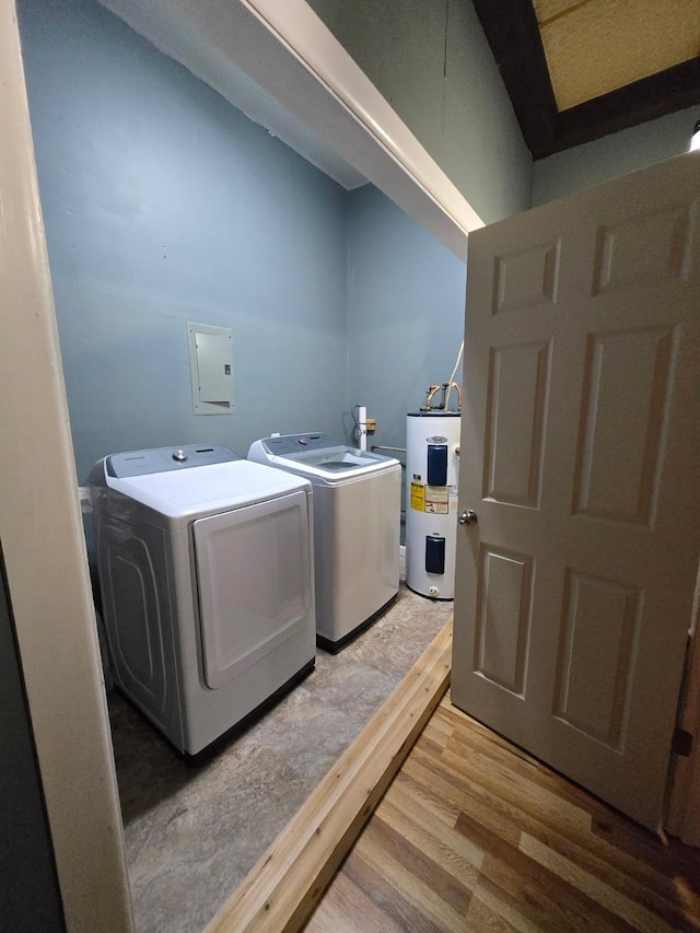 117 June Dr, Dickson, TN 37055 - washroom featuring water heater, washer and clothes dryer, light wood-style flooring, and electric panel