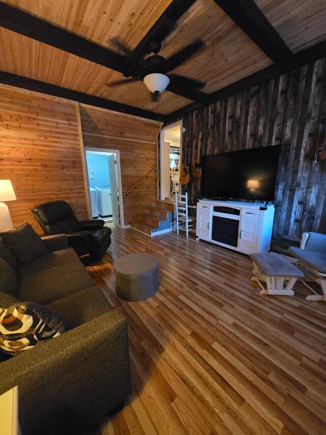 117 June Dr, Dickson, TN 37055 - living room with wood walls, a wood ceiling with exposed beams, wood finished floors, and a ceiling fan