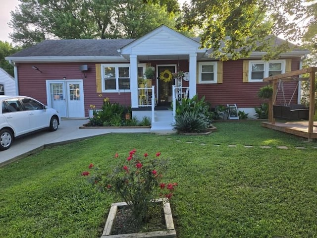 117 June Dr, Dickson, TN 37055 - view of front of home featuring a front lawn and a shingled roof
