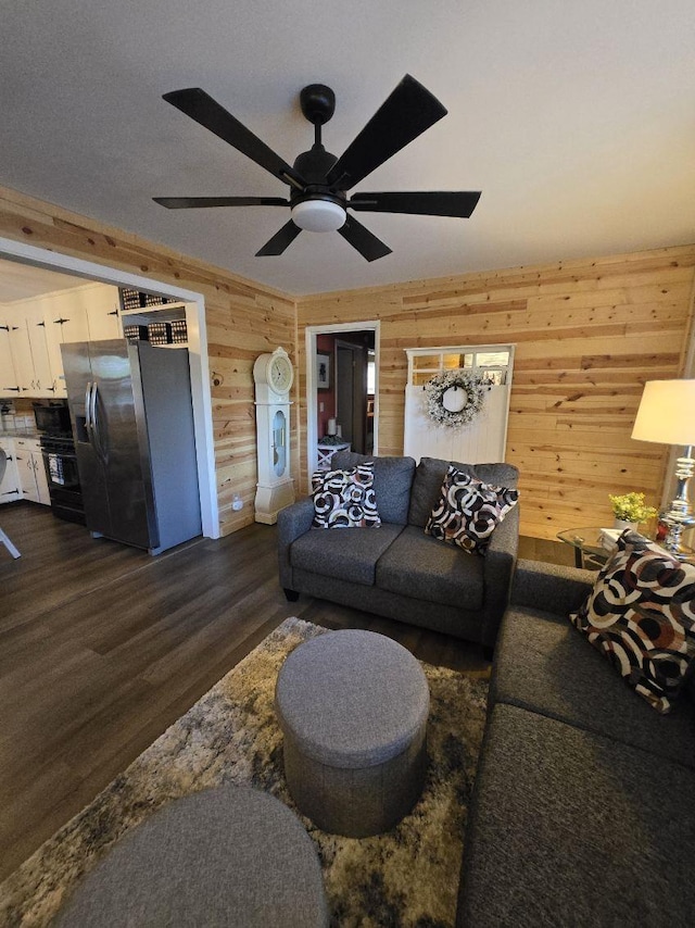 117 June Dr, Dickson, TN 37055 - living area featuring wooden walls, dark wood-style floors, and a ceiling fan