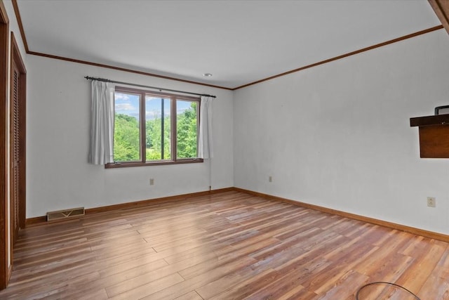 428 Gwin Cemetery Rd, Waverly, TN 37185 - empty room with ornamental molding and wood finished floors