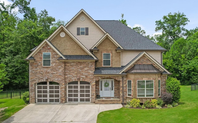 8366 Gracie Mac Ln, Ooltewah, TN 37363 - view of front of home featuring roof with shingles, driveway, an attached garage, a standing seam roof, and brick siding