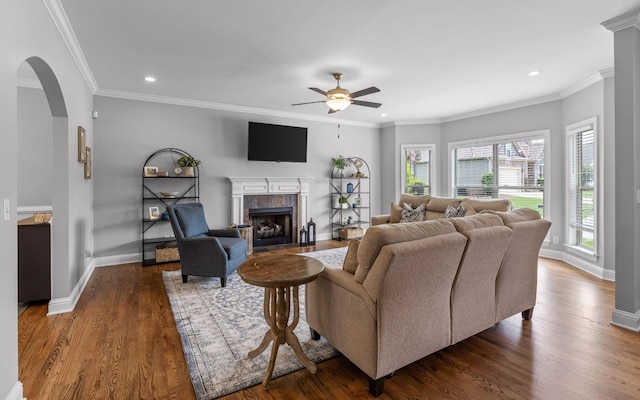 8366 Gracie Mac Ln, Ooltewah, TN 37363 - living room with ceiling fan, arched walkways, a premium fireplace, recessed lighting, and wood finished floors