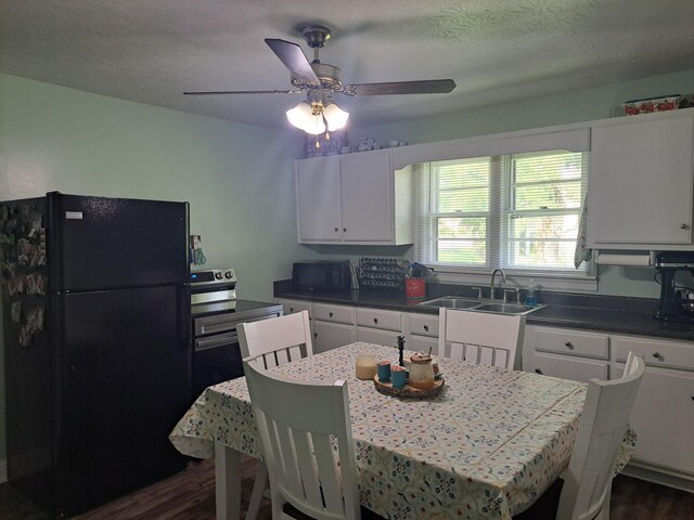808 Days Rd, Lafayette, TN 37083 - kitchen featuring black appliances, dark wood-style floors, white cabinetry, dark countertops, and a ceiling fan