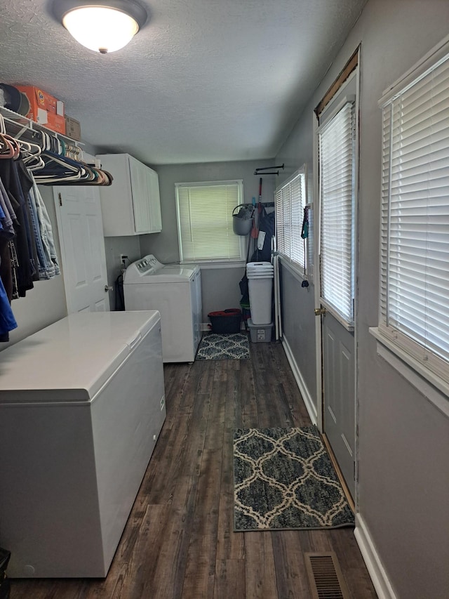 808 Days Rd, Lafayette, TN 37083 - washroom featuring cabinet space, washer and clothes dryer, dark wood-style floors, and a textured ceiling