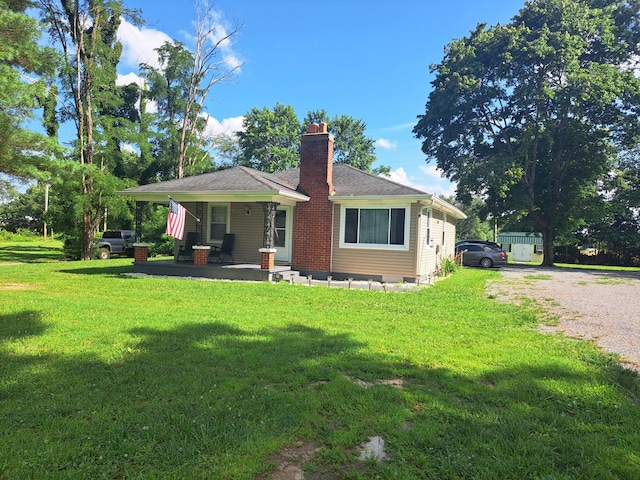 808 Days Rd, Lafayette, TN 37083 - view of front of property featuring a chimney, a front yard, and covered porch