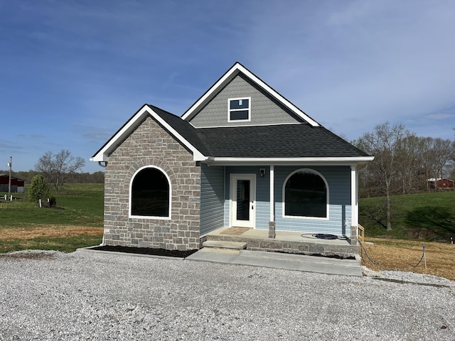 5291 Galen Rd, Lafayette, TN 37083 - view of front of house with a porch, a shingled roof, and stone siding