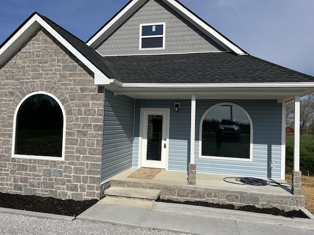 5291 Galen Rd, Lafayette, TN 37083 - view of front facade featuring covered porch, a shingled roof, and stone siding