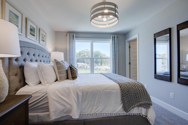 5219 Gladecress Ln, Hermitage, TN 37076 - carpeted bedroom with baseboards and a chandelier