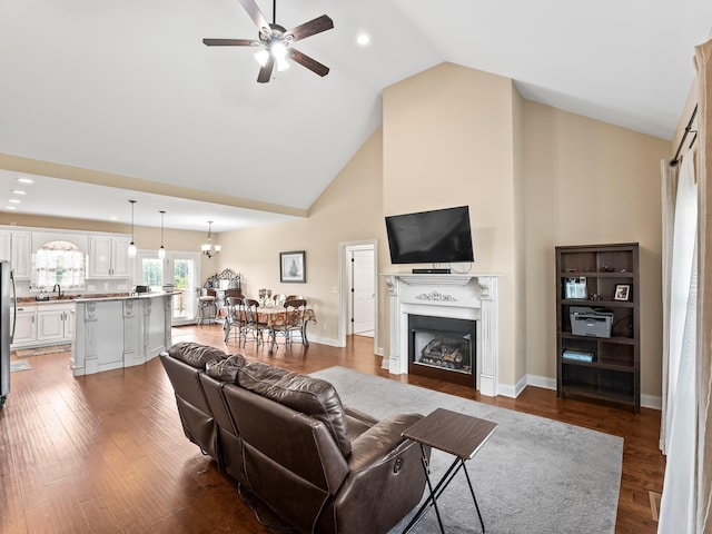 8300 Aedc Rd, Estill Springs, TN 37330 - living room with high vaulted ceiling, ceiling fan, a fireplace, dark wood finished floors, and recessed lighting