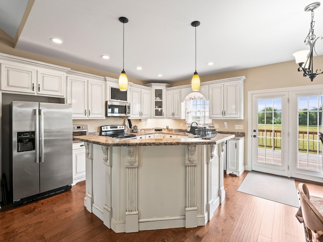 8300 Aedc Rd, Estill Springs, TN 37330 - kitchen featuring stainless steel appliances, white cabinets, dark wood finished floors, stone counters, and recessed lighting
