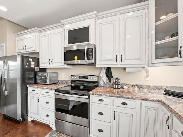 8300 Aedc Rd, Estill Springs, TN 37330 - kitchen with stainless steel appliances, white cabinets, glass insert cabinets, dark wood-type flooring, and light stone countertops