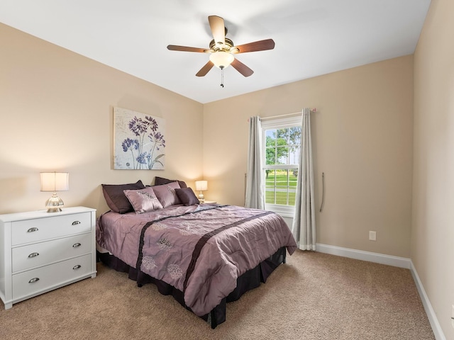 8300 Aedc Rd, Estill Springs, TN 37330 - bedroom with light colored carpet and a ceiling fan