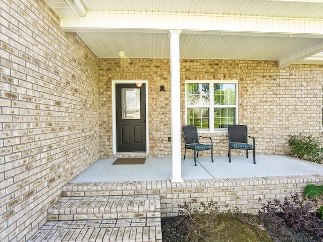 8300 Aedc Rd, Estill Springs, TN 37330 - doorway to property featuring covered porch and brick siding