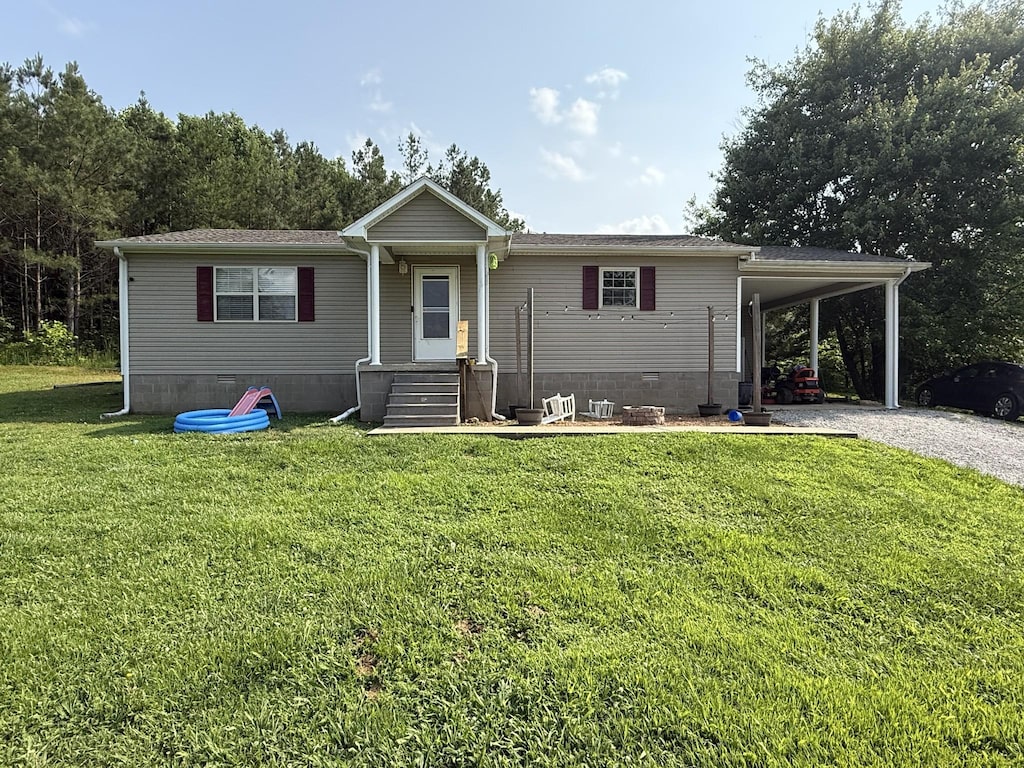 3640 Woodburn Hay Rd, Hopkinsville, KY 42240 - view of front of home featuring a front yard, crawl space, a carport, and gravel driveway