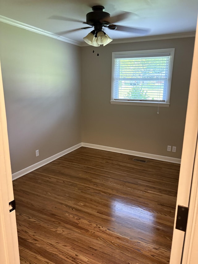 310 Lynwood Cir, Springfield, TN 37172 - spare room featuring crown molding, a ceiling fan, and dark wood-style flooring