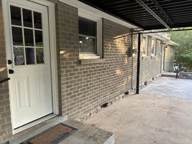 310 Lynwood Cir, Springfield, TN 37172 - entrance to property featuring brick siding, crawl space, and a patio