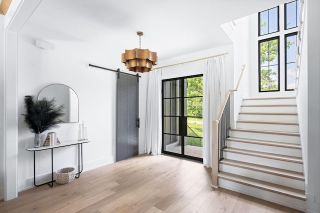1526 Lipscomb Dr, Brentwood, TN 37027 - foyer with a barn door, wood finished floors, and stairs