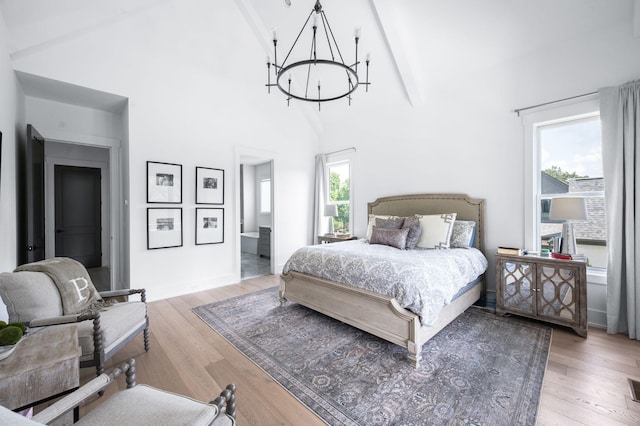 1526 Lipscomb Dr, Brentwood, TN 37027 - bedroom featuring a chandelier, beam ceiling, wood finished floors, high vaulted ceiling, and connected bathroom