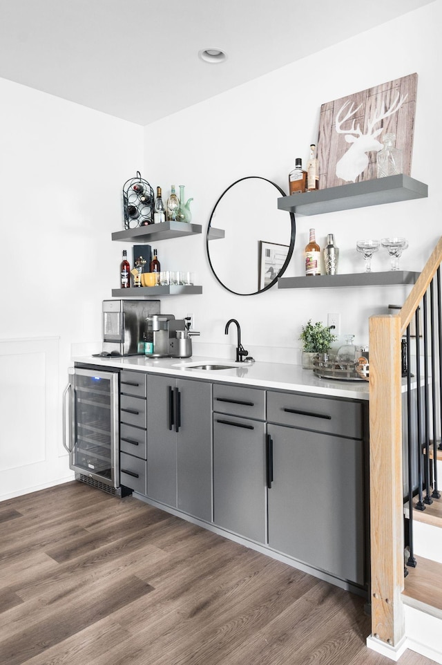 1526 Lipscomb Dr, Brentwood, TN 37027 - indoor wet bar with wine cooler, dark wood finished floors, stainless steel microwave, and recessed lighting