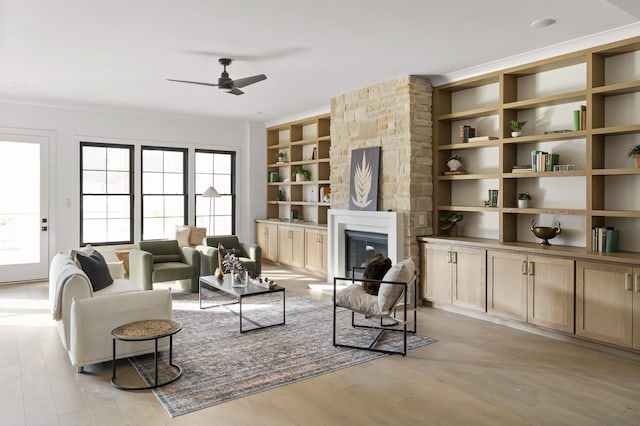 1601 S Observatory Dr Unit C, Nashville, TN 37215 - living room with built in features, a ceiling fan, a glass covered fireplace, and light wood finished floors
