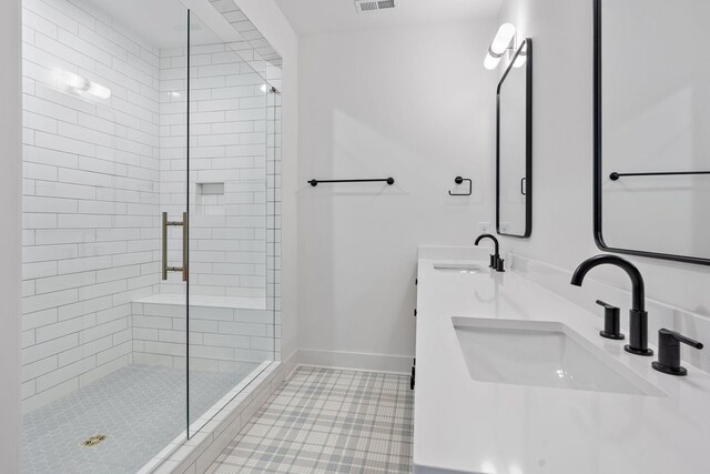 1601 S Observatory Dr Unit C, Nashville, TN 37215 - bathroom with a shower stall, double vanity, and tile patterned flooring