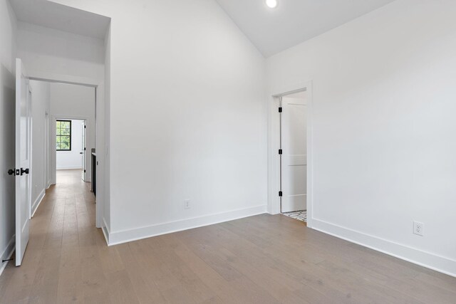 1601 S Observatory Dr Unit C, Nashville, TN 37215 - spare room featuring wood finished floors, vaulted ceiling, and recessed lighting