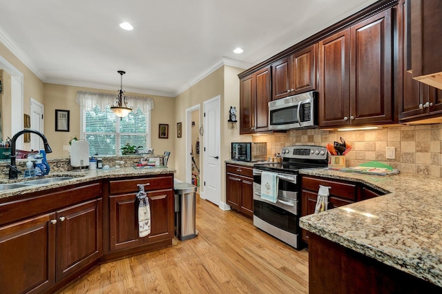 7003 Neville Dr, Ooltewah, TN 37363 - kitchen featuring appliances with stainless steel finishes, light wood finished floors, ornamental molding, decorative light fixtures, and light stone countertops