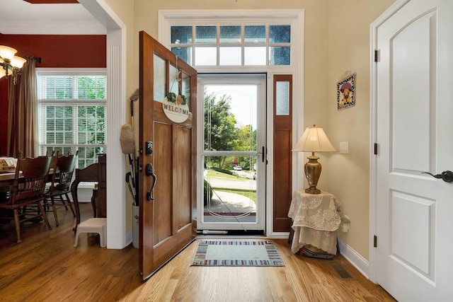 7003 Neville Dr, Ooltewah, TN 37363 - entrance foyer featuring wood finished floors and ornamental molding
