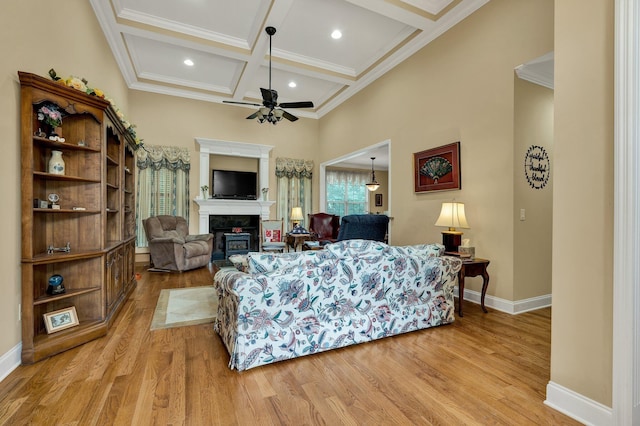 7003 Neville Dr, Ooltewah, TN 37363 - living area featuring a fireplace, ceiling fan, light wood-style floors, coffered ceiling, and beam ceiling