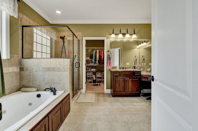 7003 Neville Dr, Ooltewah, TN 37363 - bathroom with vanity, a tub with jets, a shower stall, crown molding, and a spacious closet