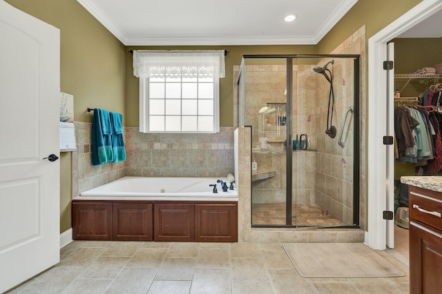 7003 Neville Dr, Ooltewah, TN 37363 - full bath featuring a garden tub, ornamental molding, a shower stall, a spacious closet, and recessed lighting