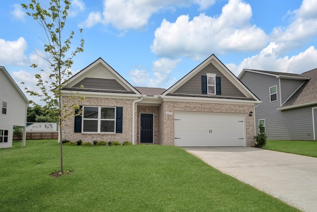 217 Summerlin Dr, Gallatin, TN 37066 - craftsman inspired home featuring brick siding, concrete driveway, a front lawn, and a garage