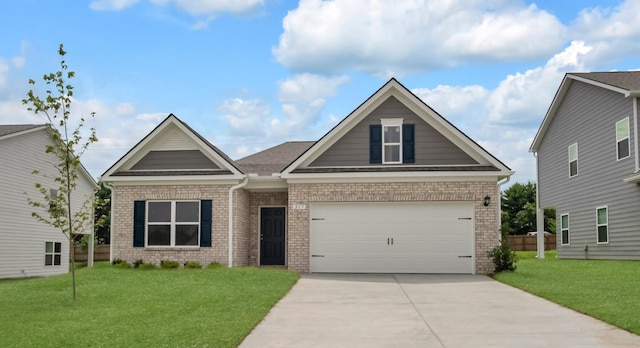 217 Summerlin Dr, Gallatin, TN 37066 - craftsman house featuring brick siding, driveway, and a front yard