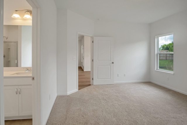 217 Summerlin Dr, Gallatin, TN 37066 - carpeted empty room with a sink and baseboards