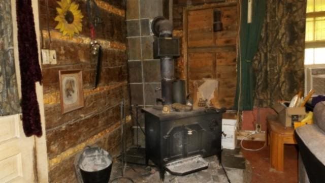 105 Log Home Ln, Moss, TN 38575 - bathroom featuring a wood stove