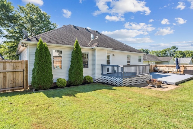 1902 Vicksburg Cir, Columbia, TN 38401 - back of property featuring a wooden deck, an outdoor fire pit, and a shingled roof