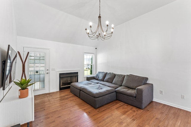 1902 Vicksburg Cir, Columbia, TN 38401 - living room featuring a chandelier, wood finished floors, a fireplace, and lofted ceiling