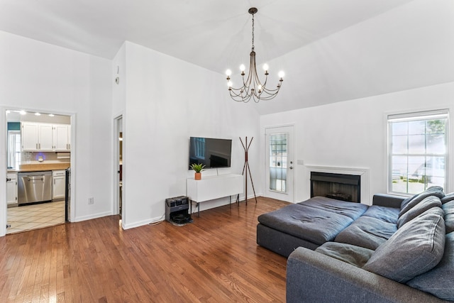 1902 Vicksburg Cir, Columbia, TN 38401 - living room with high vaulted ceiling, a chandelier, wood finished floors, and a fireplace
