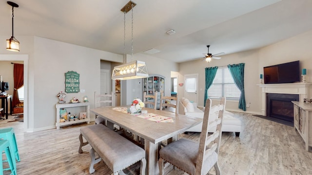 308 Whisper Wood Way, Lebanon, TN 37087 - dining area featuring light wood-style floors, ceiling fan, and a fireplace with flush hearth