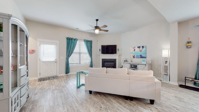 308 Whisper Wood Way, Lebanon, TN 37087 - living area featuring a ceiling fan, light wood finished floors, and a glass covered fireplace
