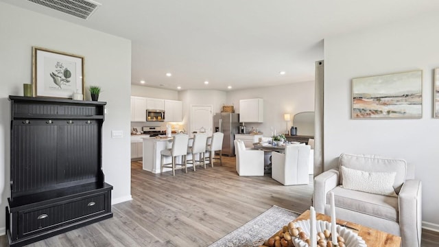 99 Hartmann Crossing Dr, Lebanon, TN 37087 - living area featuring light wood-style flooring and recessed lighting
