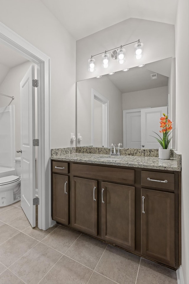 10787 Prairie Lake Dr, Apison, TN 37302 - full bathroom featuring vanity, tile patterned floors, vaulted ceiling, and a shower